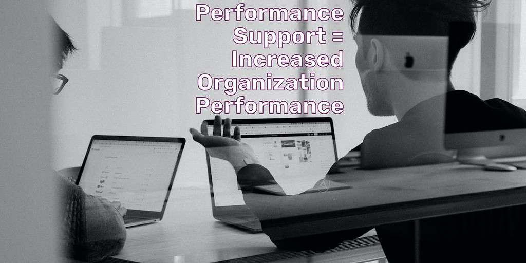 A man working at a laptop talking to another who's also on a laptop. Text overlay: Performance Support = Increased Organization Performance